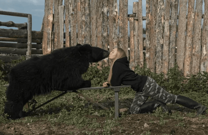 Woman And A Bear