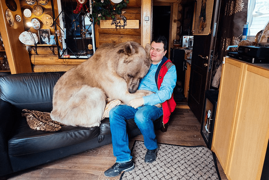 Russian Couple with Orphaned Bear 