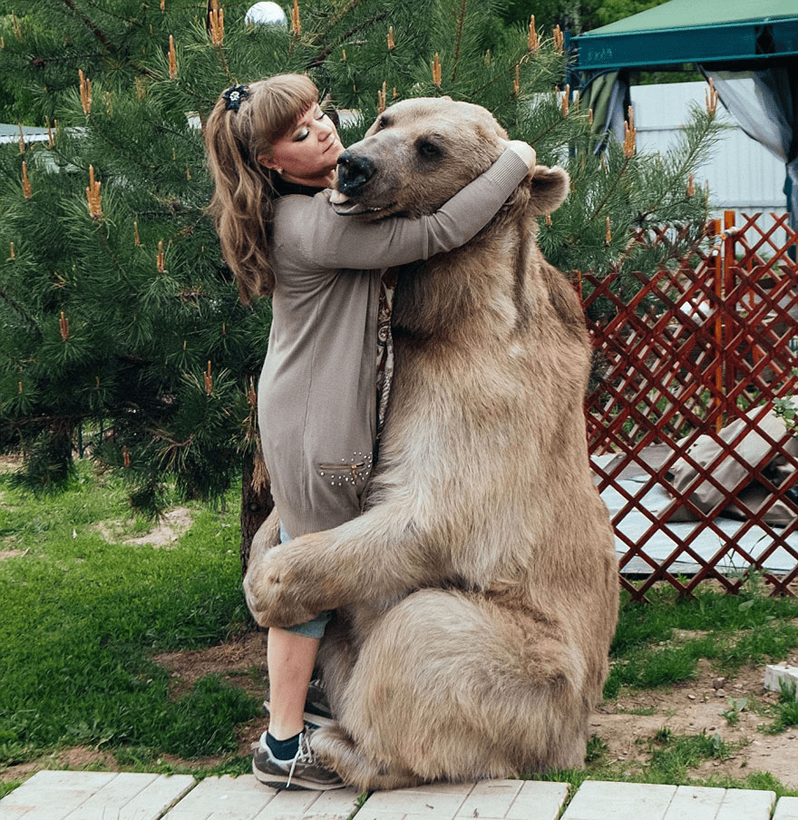 Russian Couple with Orphaned Bear 