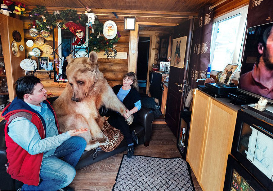 Russian Couple with Orphaned Bear 