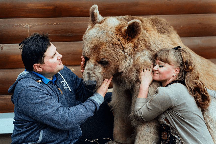 Russian Couple with Orphaned Bear 