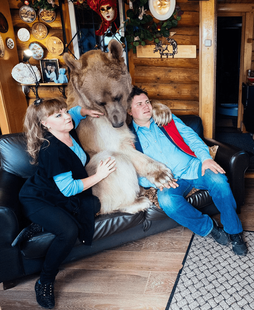 Russian Couple with Orphaned Bear 