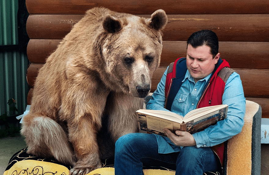 Russian Couple with Orphaned Bear 