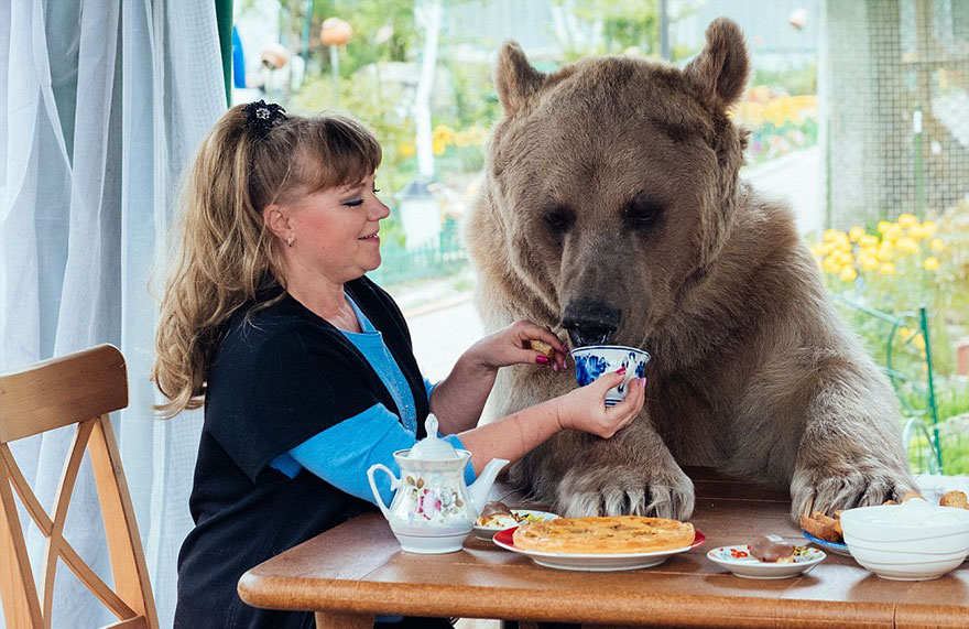 Russian Couple with Orphaned Bear 